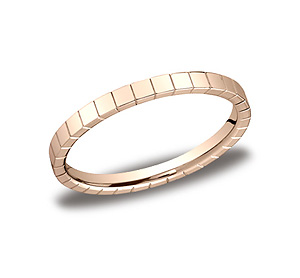 This unique 2mm carved band features a high polished square design.