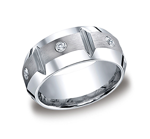 This unique Cobalt 10mm comfort-fit satin-finished band features high polished horizontal grooves between three round ideal-cut stones. This band also features a high polished beveled edge. Approximate total diamond carat weight is .20ct.