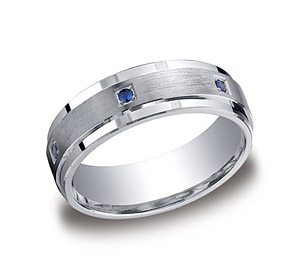 This Argentium Silver 7mm comfort-fit pave set band features a satin-finished center with six round sapphire stones that offer remarkable style. Approximate total diamond carat weight is .12ct.