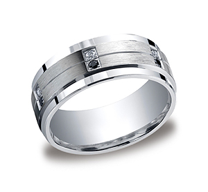 This elegant Argentium Silver 9mm comfort-fit pave set band features twelve round ideal-cut white and black diamonds along a satin-finished center with a thin center cut and high polished edges. Approximate total diamond carat weight is .24ct.