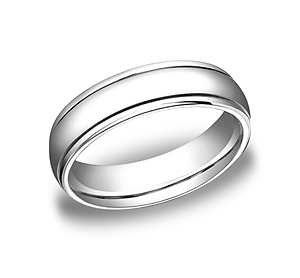 This gorgeous 6mm comfort-fit high polished carved design band appears modern with the simplicity of a traditional band.