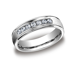 This beautiful Platinum 6mm comfort-fit channel set diamond band features a high polished round edge that surrounds 7 beautiful round ideal-cut diamonds. Total diamond carat weight is approximately .42ct.
