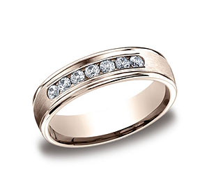 This beautiful 6mm comfort-fit channel set diamond band features a high polished round edge that surrounds 7 beautiful round ideal-cut diamonds. Total diamond carat weight is approximately .42ct.