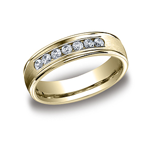 This beautiful 6mm comfort-fit channel set diamond band features a high polished round edge that surrounds 7 beautiful round ideal-cut diamonds. Total diamond carat weight is approximately .42ct.