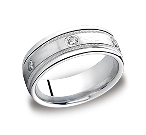 This elegant Palladium 8mm comfort-fit bezel set eternity band features a satin-finished center with six round cut diamonds along the center surrounded by milgrain and a high polished round edge. Total diamond carat weight is approximately .48ct.