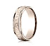 This 6mm comfort-fit carved design band features a hammered-finished center with a milgrain pattern along the high polished edge for a stylish look.
