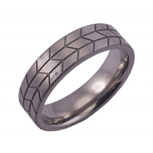 6MM FLAT TITANIUM BAND WITH TIRE TREAD TOOLING IN A SATIN FINISH.
