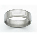 7MM BEVELED TITANIUM BAND WITH 3 DOMES IN CENTER. THE CENTER IS POLISHED A...
